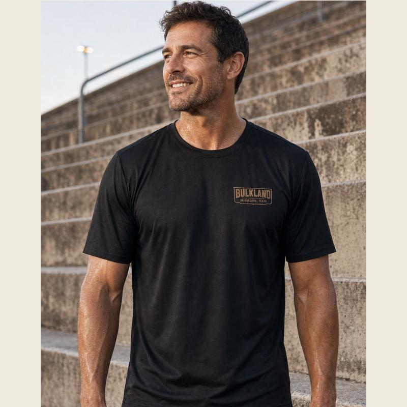 Athlete wearing the front of the black Bulkland AO Performance Tee