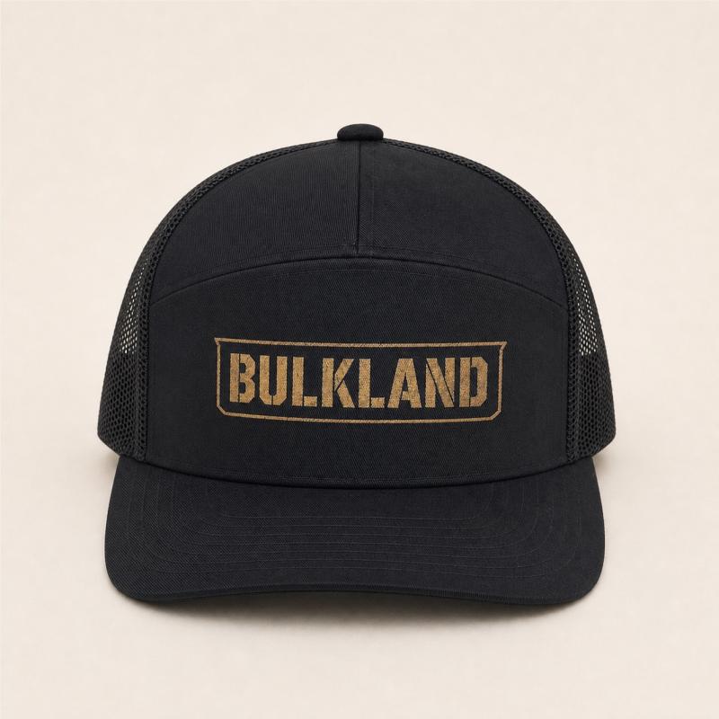 Straight front view of the black Bulkland AO trucker hat with weathered-gold Bulkland mark