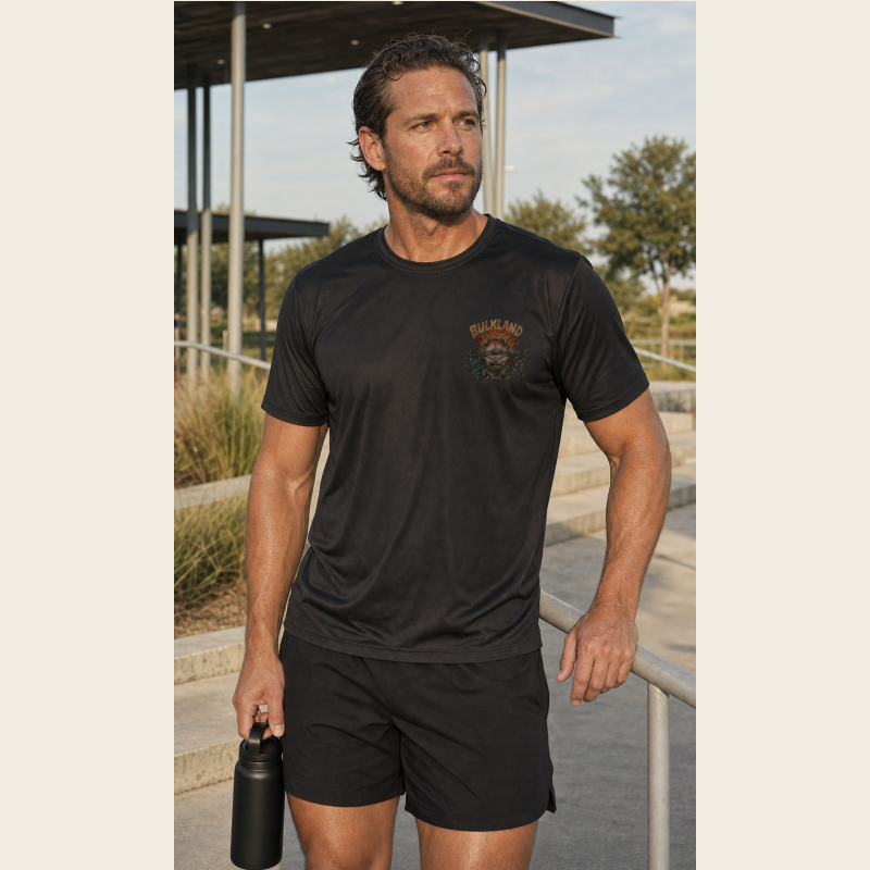 Athlete wearing the front of the Brute Attacks Bulkland Performance Tee after an outdoor workout